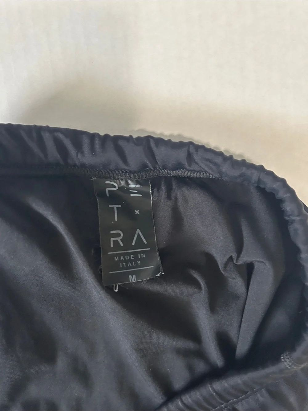 Petra Fashions Black Swim Trunks with White Logo Accent